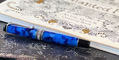 Aurora_optima_auroloide_blue_chrome_rollerball_pen_with_book