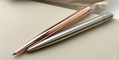 kaweco_liliput_ballpoint_pens_copper_stainless_steel_on_notebook