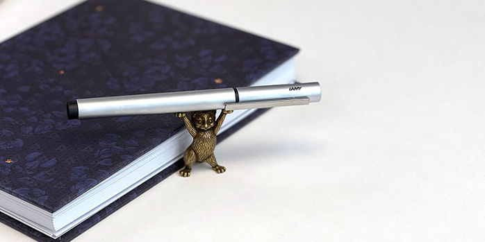 lamy_pur_silver_fountain_pen_with_brass_cat_pen_holder