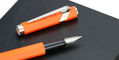 caran_d_ache_849_fountain_pen_fluorescent_orange_uncapped