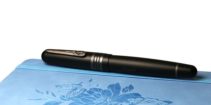 stipula_etruria_gorilla_fountain_pens_capped_on_blue_notebook