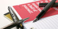 diplomat_esteem_black_barely_and_dark_blue_pens_all_on_notebook