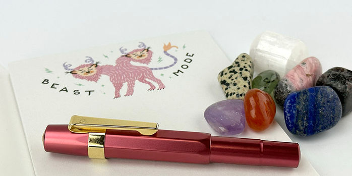 kaweco_al_sport_ruby_special_edition_fountain_pen_with_gold_clip_on_beast_mode_notebook