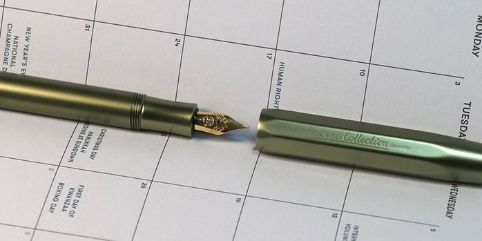 kaweco_al_sport_special_edition_olivine_fountain_pen_in_notebook