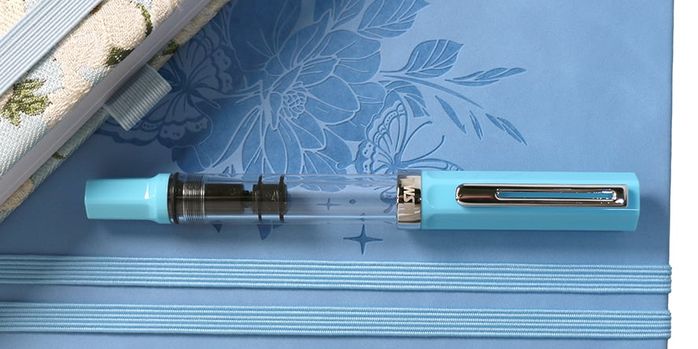 twsbi_eco_sky_blue_fountain__pen_capped_on_notebooks