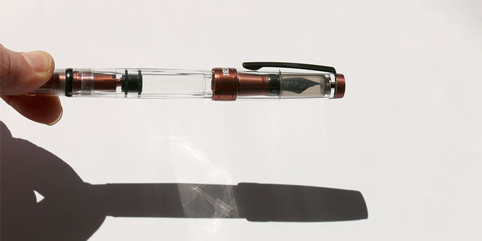 twsbi_diamone_580_alr_affogato_with_onyx_fountain_pens_capped_in_hand