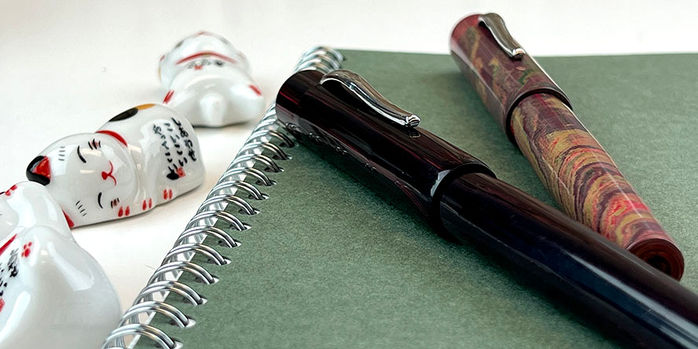 ranga_model_3_fountain_pens_with_dice_and_notebook