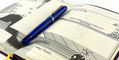 opus_88_jazz_transparent_blue_fountain_pen_capped_inside_the_hero_journal