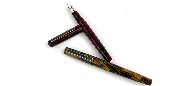 tibaldi_infrangibile_all_chrome_yellow_and_all_mauve_red_uncapped_fountain_pens