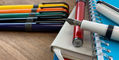 pineider_metropolis_fountain_pens_one_uncapped_on_notebooks