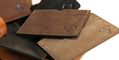 dee_charles_designs_leather_wallet_in_hand_statue