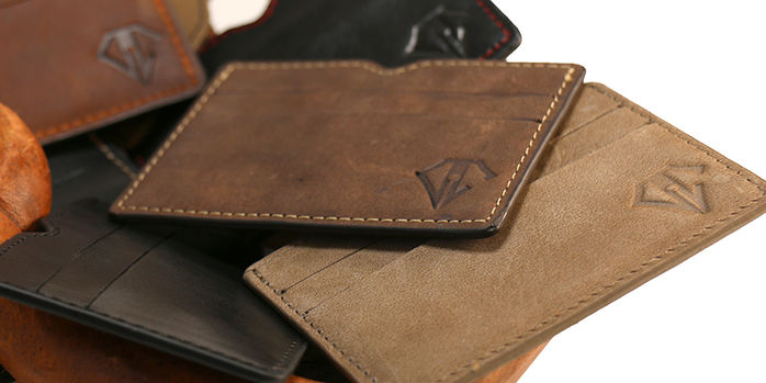 dee_charles_designs_leather_wallet_in_hand_statue