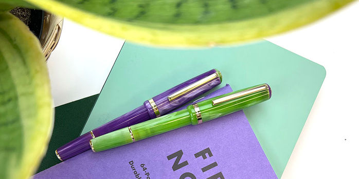esterbrook_jr_pocket_paradise_fountain_pens_purple_passion_and_key_lime_through_green_leaves