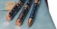 conklin_endura_deco_crest_demo_blue_rose_gold_ballpoint_pen_on_notebook