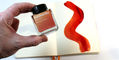Wearingeul_world_lit_siddhartha_ink_bottle_in_hand_above_ink_swatch