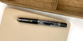 pelikan_souveran_605_tortoiseshell_black_fountain_pen_capped_on_notebook