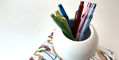 Caran_d'Ache_849_Claim_Your_Style_Limited_Edition_4_Ballpoint_Pens_on_book