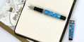 aurora_optima_365_celeste_blue_fountain_pen_uncapped