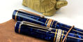 maiora_limited_edition_capri_alpha_eyedropper_fountain_pens_closeup_of_caps