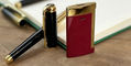 st_dupont_slim_7_red_gold_lighter_standing_on_end