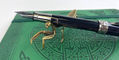 pen_chalet_sassy_brassy_praying_mantis_pen_rests_face