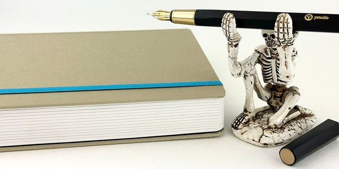 endless_2023_regalia_planner_closed_with_forevermore_skeleton_pen_holder_and_ystudio_resin_fountain_pen