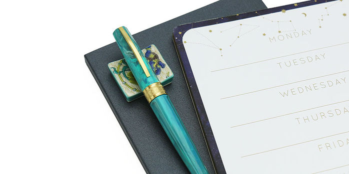 visconti_mirage_mythos_collection_fountain_pen_athena_capped_on_notebooks
