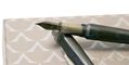 visconti_mirage_mythos_collection_fountain_pen_poseidon_uncapped_on_notebook