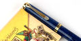 pelikan_m800_blue_o_blue_fountain_pen_capped_by_notebook