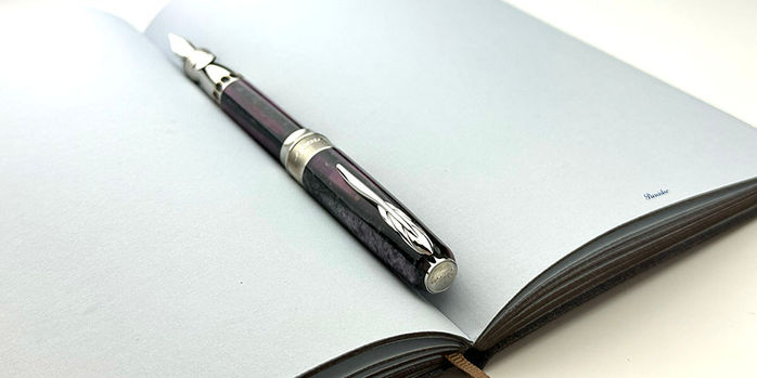 pineider_arco_stilo_violet_limited_edition_fountain_pen_posted_in_pineider_blues_notebook