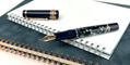 maiora_amalfi_rose_gold_fountain_pen_uncapped_on_notebooks