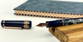 maiora_amalfi_rose_gold_fountain_pen_uncapped_on_wood_block