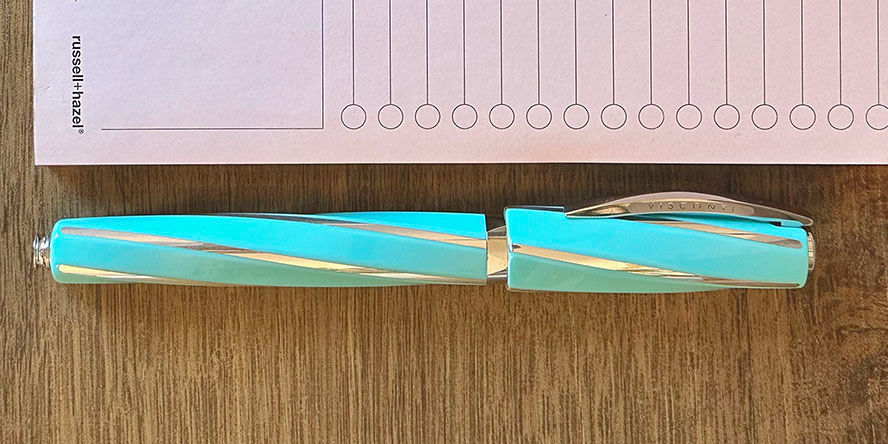 Visconti Divina Elegance Wave Rollerball Pens visconti_divina_elegance_wave_rollerball_pen_capped_by_notepad