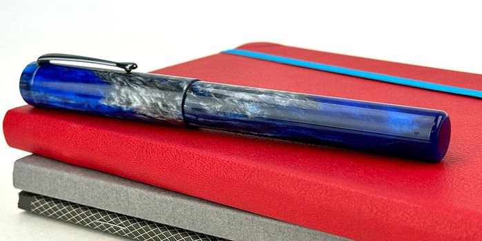 hinze_a24_blue_storm_fountain_pen_on_red_endless_recorder_capped_from_side