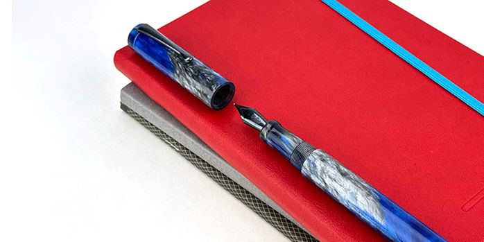 hinze_a24_blue_storm_fountain_pen_on_red_endless_recorder_uncapped_showing_gunmetal_nib