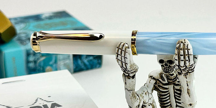 pelikan_special_edition_200_pastel_blue_fountain_pen_with_forevermore_skeleton_pen_holder
