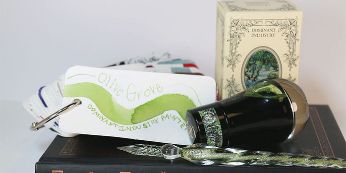 dominant_industry_olive_grove_ink_styled_on_notebook