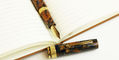 omas_paragon_fountain_pen_blue_saffron_in_notebook