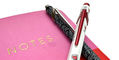 caran_d_ache_849_keith_haring_special_edition_ballpoint_pens_on_notebook