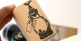 dominant_industry_archiving_wood_stamp_in_hand