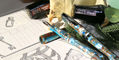 dominant_industry_ink_archiving_book_volume_2_log_of_elixir_opened_with_pens
