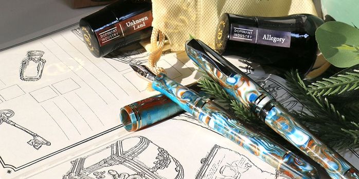 dominant_industry_ink_archiving_book_volume_2_log_of_elixir_opened_with_pens