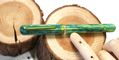 nahvalur_voyage_spring_fountain_pen_capped_on_wood