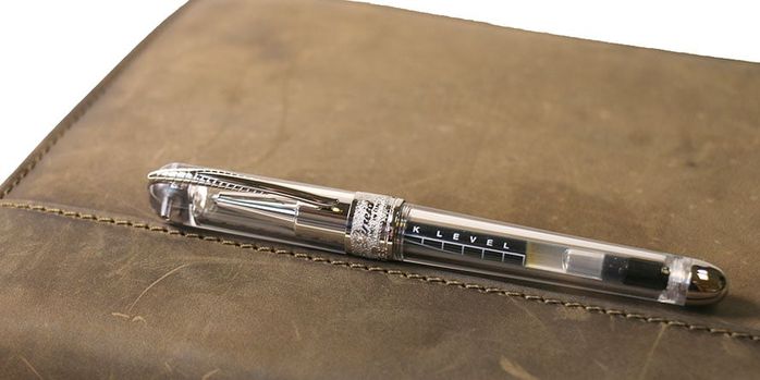 pineider_avatar_ur_mini_rollerball_pen_on_notebook