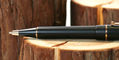 delta_duna_matte_black_ballpoint_pen_on_wood