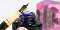 laban_325_damask_celluloid_fountain_pen_nib_resting_on_private_reserve_ink