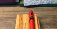 sheaffer_icon_rollerball_metallic_red_on_pen_rest