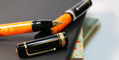delta_dv_original_oversize_rollerball_pens_gold_uncapped_on_palladium