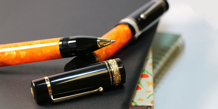 delta_dv_original_oversize_rollerball_pens_gold_uncapped_on_palladium