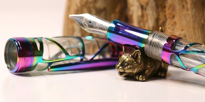 sweet_and_sassy_brassy_cat_pen_rests_curious_from_side